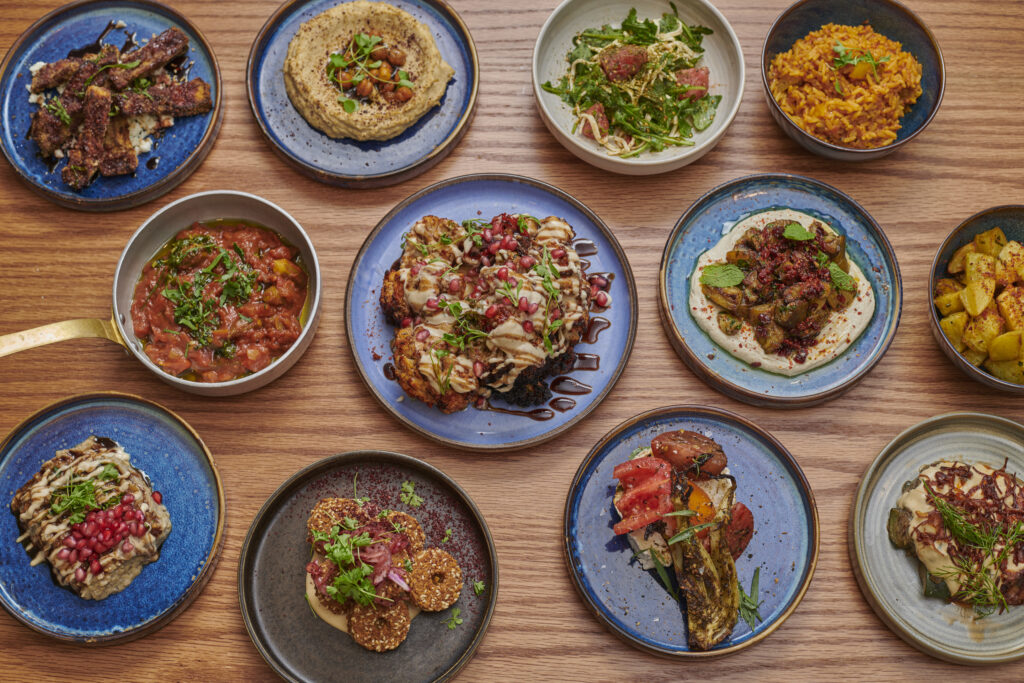 table full of Syrian dishes